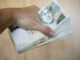 pack of money - big pile of banknotes in hand, czech crown